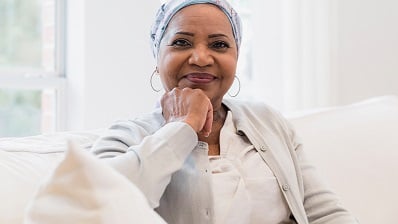 A Black woman smiling