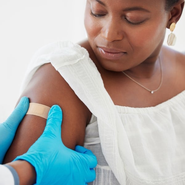 Woman receiving a vaccine