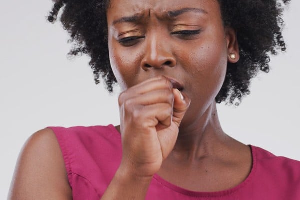 A woman coughing