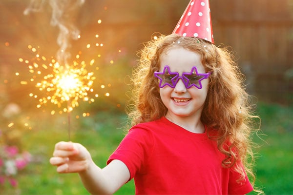 A child holding a sparkler