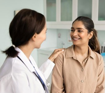 A patient talking with her OBGYN provider