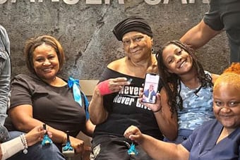 Patricia Williams surrounded by family and MetroHealth providers