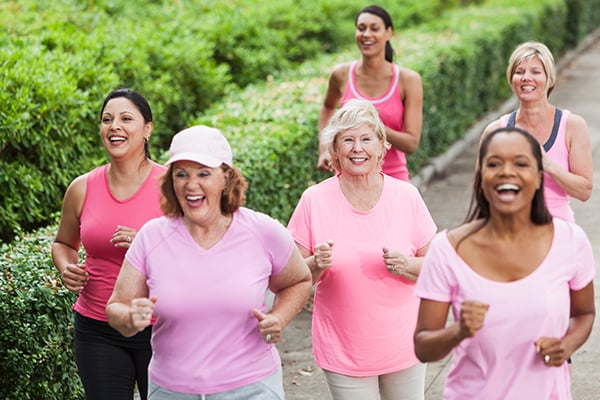 Group of women wearing pink going for a jog