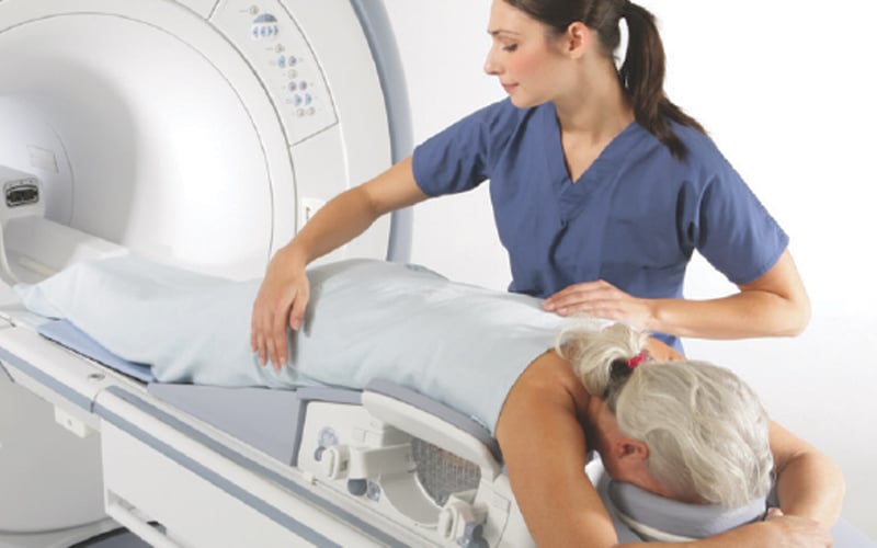 A patient receiving additional imaging as part of a biopsy