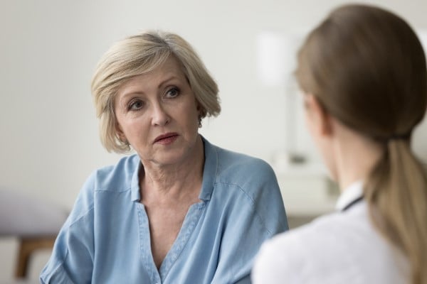 Woman having a serious discussion with her doctor