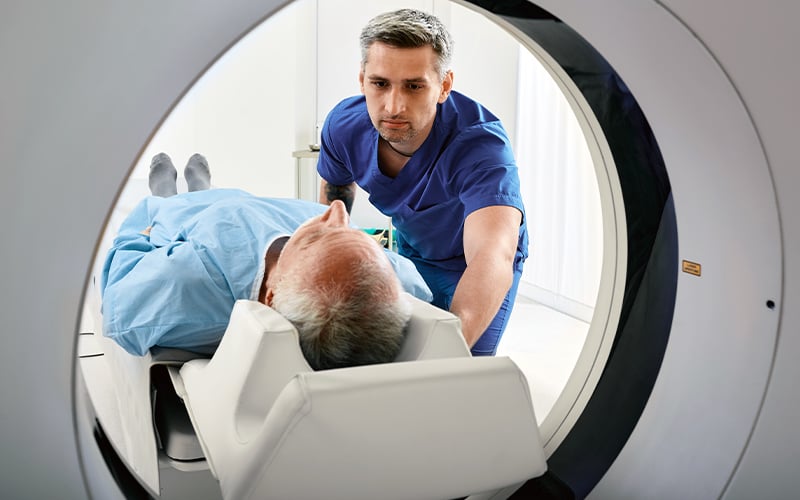 A patient entering a CT scanning machine