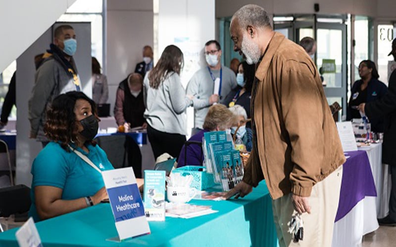 A visitor getting information at the Men's Health Fair