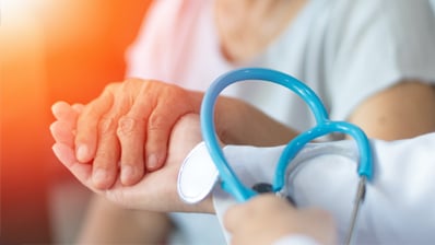 nurse holding hand of patient