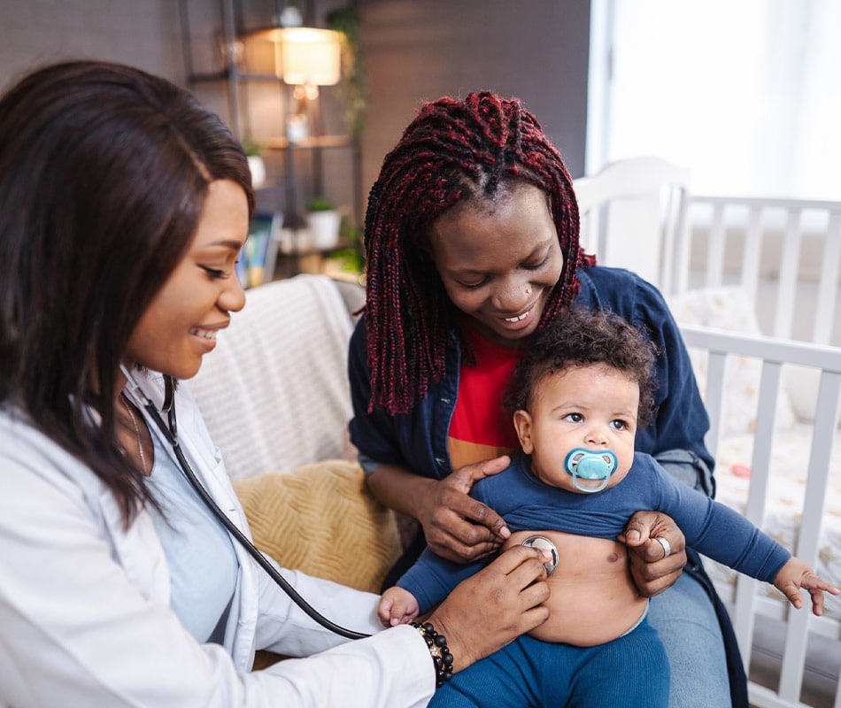 Nurse with mom and baby