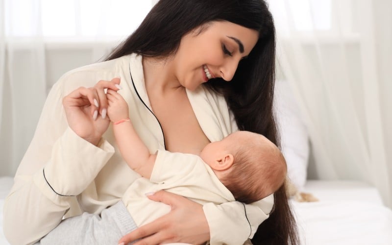 A mother holding her baby