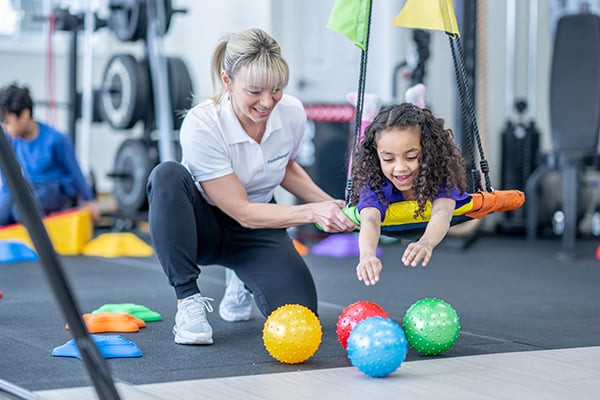 A pediatric Rehabilitation patient on a swing