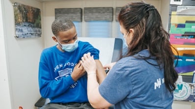 School health program student receiving a shot
